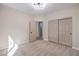 Bright bedroom features neutral walls, carpet floors, and a double door closet at 7315 Summer Air Ave, Las Vegas, NV 89179