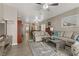 Open-concept living room seamlessly connects to other living areas, with neutral decor at 7669 Fieldfare Dr, North Las Vegas, NV 89084
