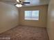 Bedroom with window, ceiling fan, carpet and neutral walls at 7963 Laurena Ave, Las Vegas, NV 89147