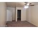 Bedroom featuring neutral walls, carpet, ceiling fan and doorway to bathroom at 7963 Laurena Ave, Las Vegas, NV 89147