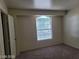 Bedroom with carpet, a window and neutral walls at 7963 Laurena Ave, Las Vegas, NV 89147
