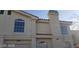 Two-story home featuring symmetrical windows and architectural details on a sunny day at 7963 Laurena Ave, Las Vegas, NV 89147