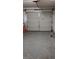Open garage with white door at 7963 Laurena Ave, Las Vegas, NV 89147