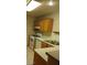 Kitchen featuring modern appliances, tile flooring, and wooden cabinets at 7963 Laurena Ave, Las Vegas, NV 89147