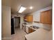 Bright kitchen with stainless steel appliances and tile flooring at 7963 Laurena Ave, Las Vegas, NV 89147