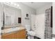 Bathroom featuring a vanity with single sink, toilet with bidet, and shower with decorative curtain at 8124 Loma Del Ray St, Las Vegas, NV 89131