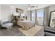 Comfortable bedroom featuring a queen-sized bed, ceiling fan, and view windows at 8124 Loma Del Ray St, Las Vegas, NV 89131