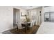 Elegant dining area with stylish chairs and a view of the adjacent kitchen at 8124 Loma Del Ray St, Las Vegas, NV 89131