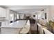 Open concept kitchen and living room featuring modern countertops, stainless steel appliances, and sleek flooring at 8124 Loma Del Ray St, Las Vegas, NV 89131
