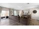 Bright living room with wood-style flooring, patio access, and built-in entertainment center at 8124 Loma Del Ray St, Las Vegas, NV 89131