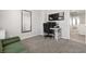 Bright home office space with grey walls, plush carpet, modern desk, and access to additional room and closet at 8124 Loma Del Ray St, Las Vegas, NV 89131