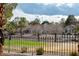 Exterior view of backyard featuring iron fence and desert landscaping at 8169 Pinnacle Peak Ave, Las Vegas, NV 89113