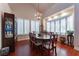 Elegant dining room featuring hardwood floors, natural light, and sophisticated decor for memorable gatherings at 8169 Pinnacle Peak Ave, Las Vegas, NV 89113