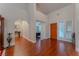 Bright foyer featuring hardwood floors, high ceilings, and natural light from the nearby windows and wooden front door at 8169 Pinnacle Peak Ave, Las Vegas, NV 89113