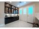 Bright kitchen featuring ample cabinet space and french doors which provide seamless indoor-outdoor living at 8169 Pinnacle Peak Ave, Las Vegas, NV 89113