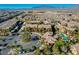 Community aerial view showcasing neighborhood, pool and palm tree-lined streets at 8250 N Grand Canyon Dr # 2059, Las Vegas, NV 89166