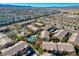 Aerial view of the community with pool, palm trees and other amenities at 8250 N Grand Canyon Dr # 2059, Las Vegas, NV 89166