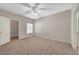 Spacious bedroom with a large closet, neutral carpeting, and natural light from the window at 8250 N Grand Canyon Dr # 2059, Las Vegas, NV 89166