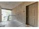 Apartment entrance featuring textured walls, door with unit number and exterior shared walkway at 8250 N Grand Canyon Dr # 2059, Las Vegas, NV 89166