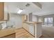 Bright, updated kitchen with stainless steel appliances and an open view to the living space at 8250 N Grand Canyon Dr # 2059, Las Vegas, NV 89166