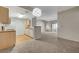Open floor plan featuring a combined living room and kitchen with sliding doors to the balcony at 8250 N Grand Canyon Dr # 2059, Las Vegas, NV 89166