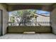 View of the covered patio overlooking mature trees and landscaping at 8250 N Grand Canyon Dr # 2059, Las Vegas, NV 89166