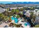 Aerial view of the community pool and jacuzzi with a mountain view at 8250 N Grand Canyon Dr # 2059, Las Vegas, NV 89166