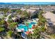 Aerial view of a community pool and jacuzzi surrounded by palm trees at 8250 N Grand Canyon Dr # 2059, Las Vegas, NV 89166