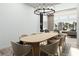 Elegant dining room with modern chandelier, seating for eight, and an open floorplan for easy entertaining at 8825-1 S Monte Cristo Way, Las Vegas, NV 89113