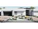Stylish modern home featuring desert landscaping, a brick driveway, and a sleek, attached two-car garage at 8825-1 S Monte Cristo Way, Las Vegas, NV 89113