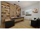 Beautiful home office featuring custom wood built-ins, modern light fixtures, and a bright, open workspace at 8825-1 S Monte Cristo Way, Las Vegas, NV 89113