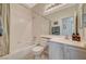 A traditional bathroom is shown, featuring a combination tub and shower and a single sink at 8856 Timber Mesa St, Las Vegas, NV 89139