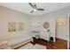 Bedroom with hardwood floors, neutral walls, ceiling fan, and decor on the walls at 8856 Timber Mesa St, Las Vegas, NV 89139