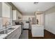 Updated kitchen with stainless steel appliances and large sink and island at 8856 Timber Mesa St, Las Vegas, NV 89139
