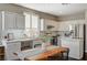 Bright, modern kitchen with stainless steel appliances, ample counter space, and a cozy dining area at 8856 Timber Mesa St, Las Vegas, NV 89139