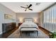 Inviting main bedroom features hardwood floors, ceiling fan, and a bench at 8856 Timber Mesa St, Las Vegas, NV 89139