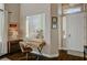 Bright home office space with hardwood floors and a view to an adjacent playroom and front entry at 8856 Timber Mesa St, Las Vegas, NV 89139
