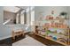 Bright playroom features hardwood floors, natural light, and charming wooden toy displays and storage at 8856 Timber Mesa St, Las Vegas, NV 89139
