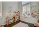 Charming playroom with natural light, wood floors, and organized shelving for toys and books at 8856 Timber Mesa St, Las Vegas, NV 89139