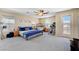 Spacious bedroom with neutral tones and a ceiling fan at 9413 Ironsend St, Las Vegas, NV 89143