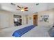 Neutral bedroom with ceiling fan and door to ensuite bathroom at 9413 Ironsend St, Las Vegas, NV 89143