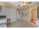 Cozy bedroom with neutral tones, ceiling fan, and closet access at 9413 Ironsend St, Las Vegas, NV 89143