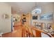 This dining room is open to the kitchen area and features wood flooring at 9413 Ironsend St, Las Vegas, NV 89143