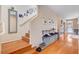 Welcoming entryway with wood floors, staircase, and decor leading to a comfortable living space at 9413 Ironsend St, Las Vegas, NV 89143