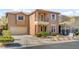 Charming two-story home with a driveway leading to the attached two car garage at 9413 Ironsend St, Las Vegas, NV 89143