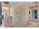 Neutral hallway with carpet, access to rooms and stairway at 9413 Ironsend St, Las Vegas, NV 89143