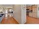 Cozy kitchen featuring stainless steel appliances and wood cabinets adjacent to the hallway at 9413 Ironsend St, Las Vegas, NV 89143