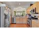This kitchen features stainless steel appliances, wood cabinets, and a gas range at 9413 Ironsend St, Las Vegas, NV 89143