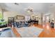 Spacious living room with a large rug, comfortable seating, and open access to other areas at 9413 Ironsend St, Las Vegas, NV 89143