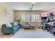 Sunlit living room with a comfortable seating arrangement and bright decor at 9413 Ironsend St, Las Vegas, NV 89143
